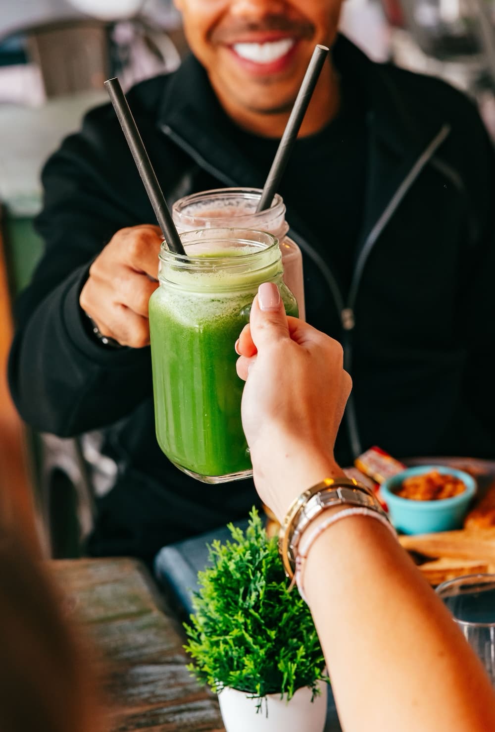 Guests sharing green juices at La Guay