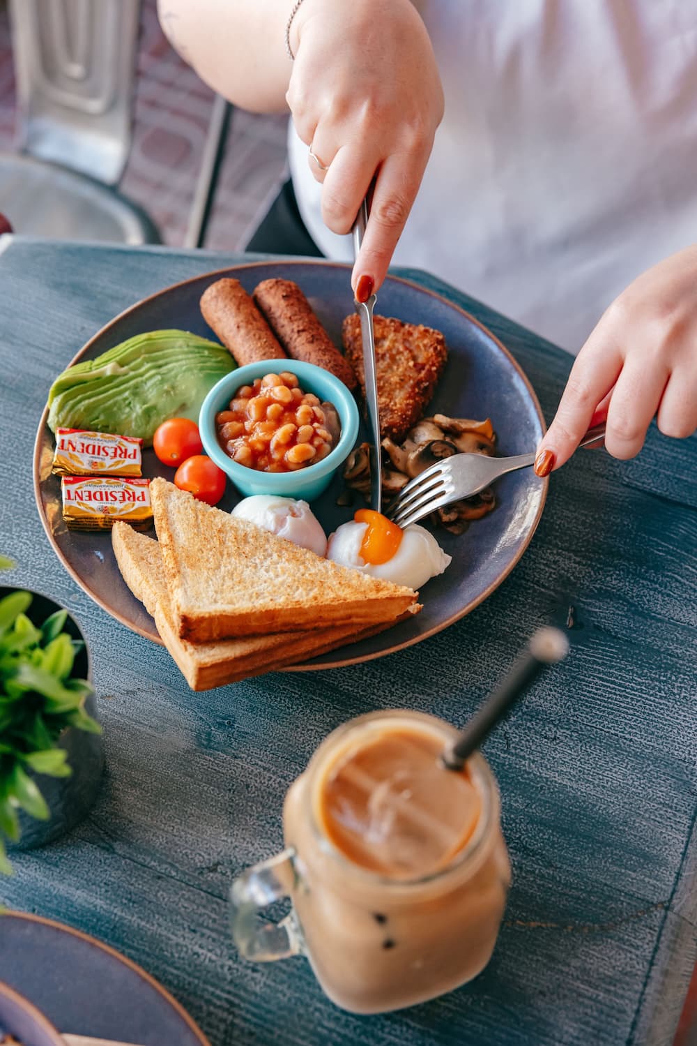Full breakfast with toast and an iced coffee